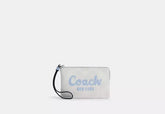 Coach Corner Zip Wristlet In Signature Canvas With Coach Script - Wallets | Shop From The Mirage