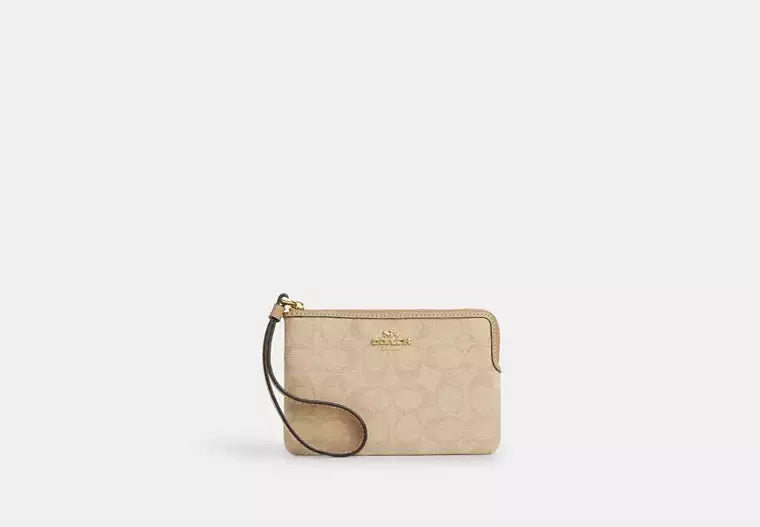 Coach Corner Zip Wristlet With Signature Canvas - Wallets | Shop From The Mirage