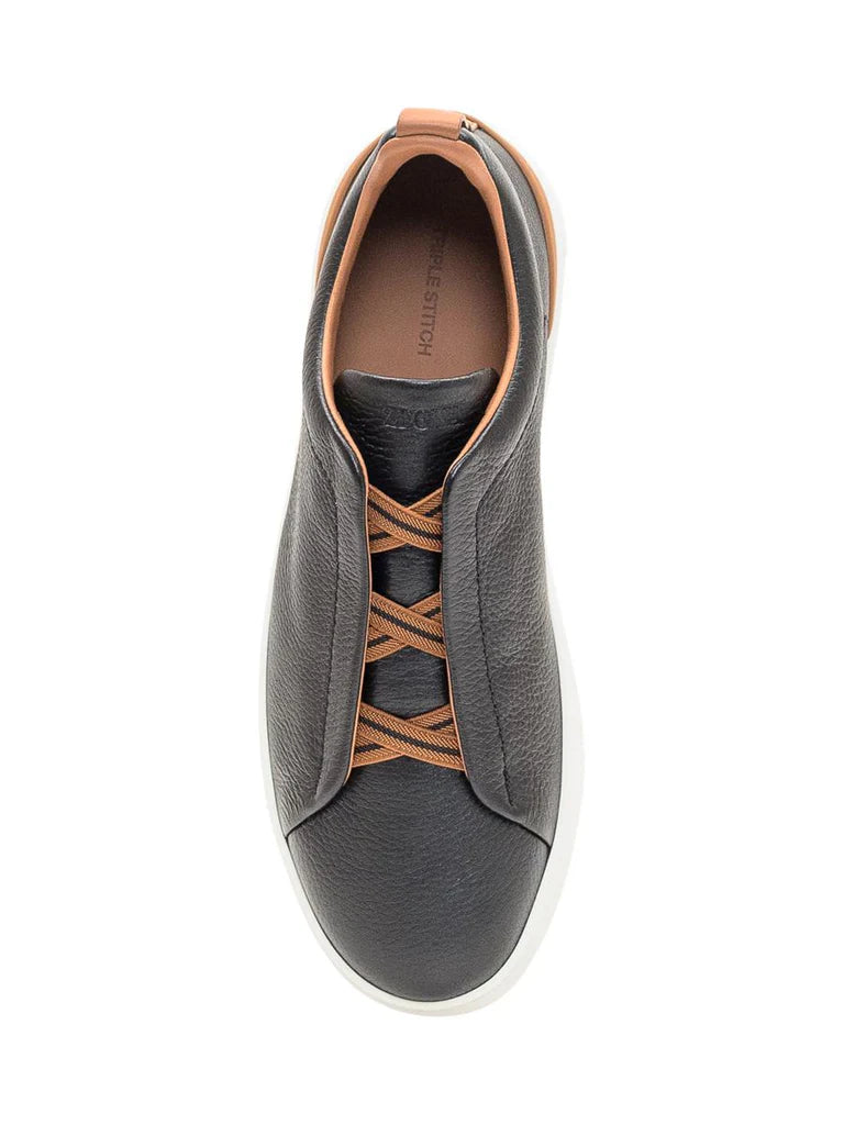 Zegna Men’s Black Grained Leather Slip-On Sneakers – White Sole, Leather-Colored Detail