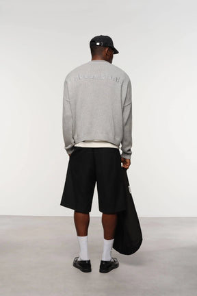 Loose knit rolled crewneck