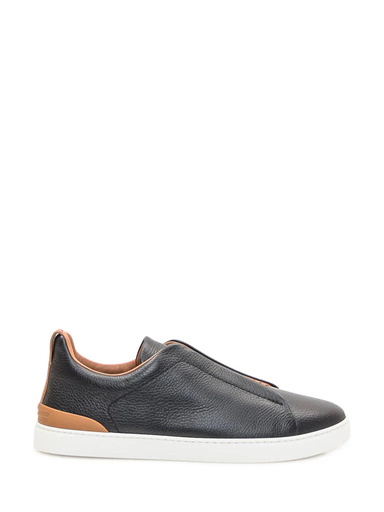 Zegna Men’s Black Grained Leather Slip-On Sneakers – White Sole, Leather-Colored Detail