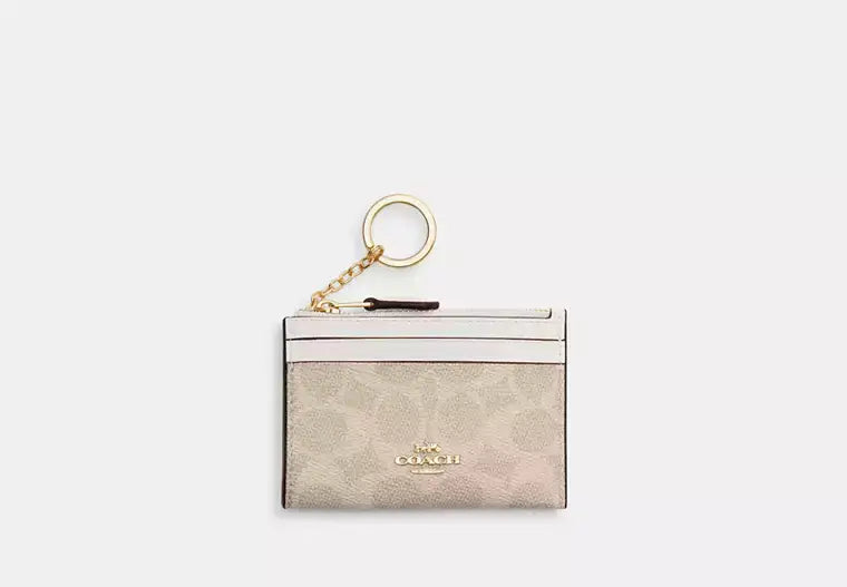 Coach Mini Skinny Id Case In Signature Canvas - Wallets | Shop From The Mirage