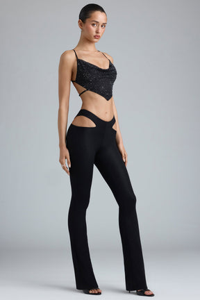 Petite Metallic Cut-Out Low-Rise Flared Trousers in Black