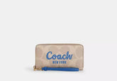 Coach Long Zip Around Wallet In Signature Canvas With Coach Graphic - Wallets | Shop From The Mirage