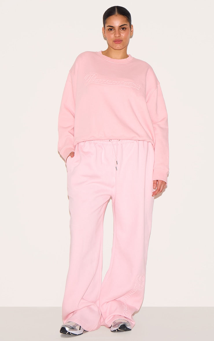 PRETTYLITTLETHING Plus Baby Pink Embossed Graphic Straight Leg Joggers