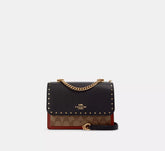 Klare Crossbody Bag In Signature Canvas With Rivets