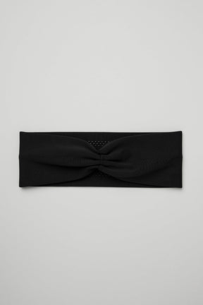 Airlift Headband in black, made from lightweight wicking fabric designed to manage sweat and keep hair in place during workouts.