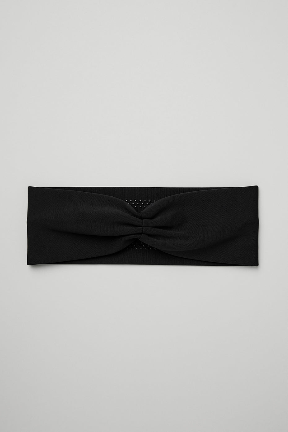 Airlift Headband in black, made from lightweight wicking fabric designed to manage sweat and keep hair in place during workouts.