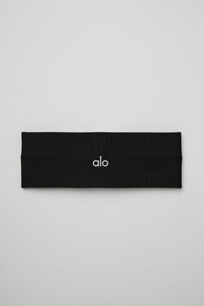 Airlift Headband in black, made from lightweight wicking fabric to manage sweat and keep hair in place during workouts.
