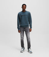 DISTRESSED SLIM JEANS