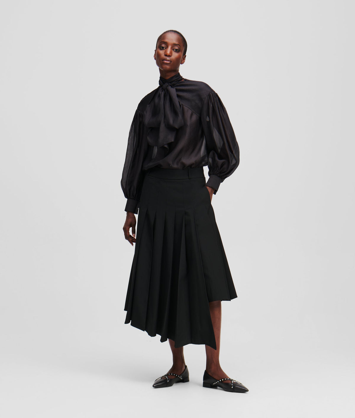 ASYMMETRIC PLEATED SKIRT
