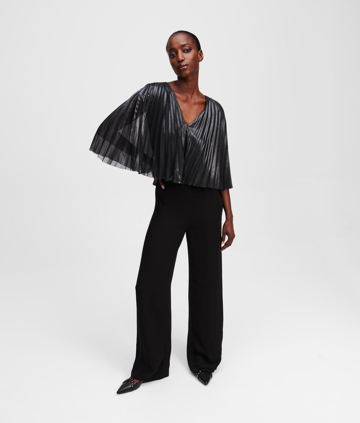 PLEATED CAPE JUMPSUIT