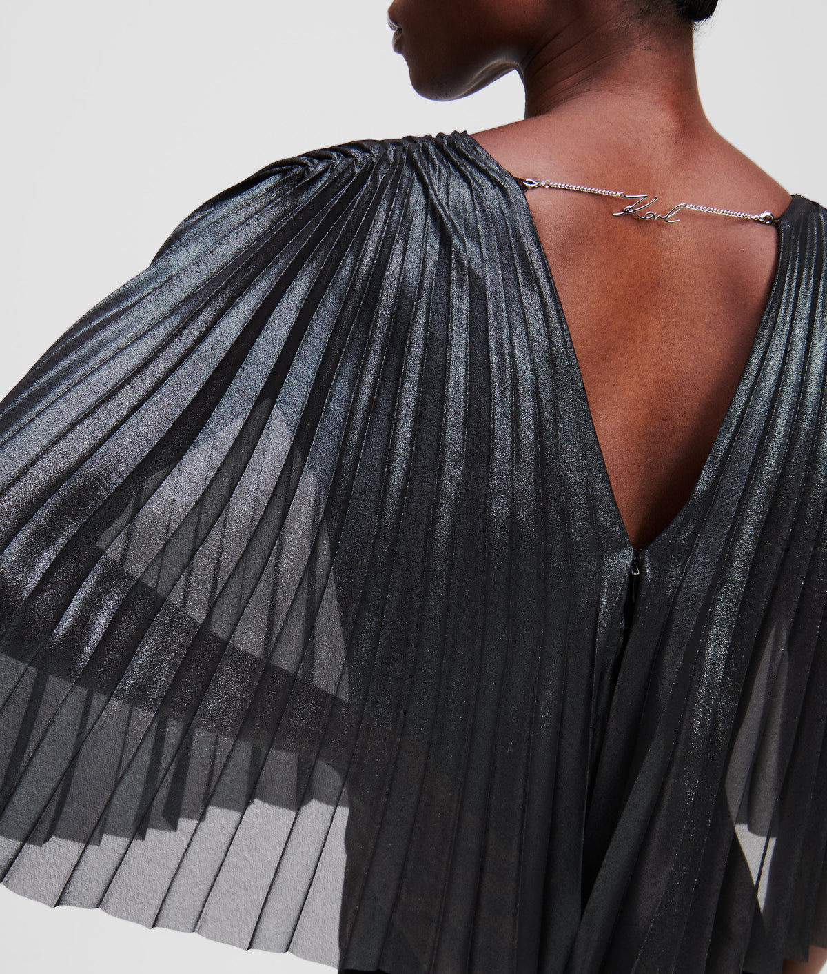 PLEATED CAPE JUMPSUIT