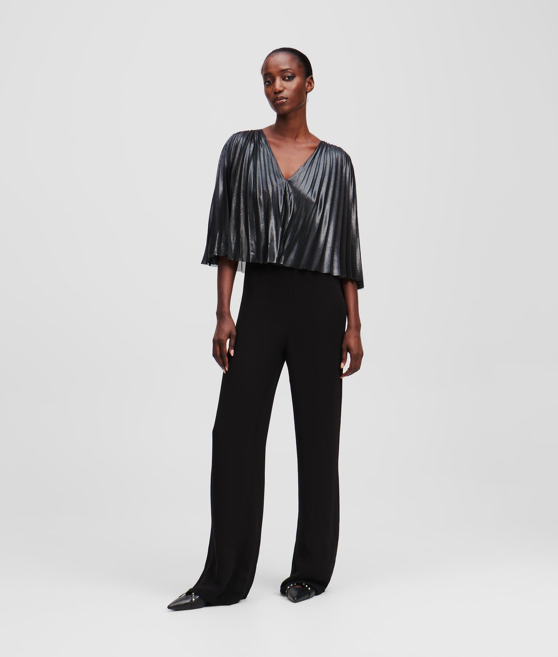 PLEATED CAPE JUMPSUIT