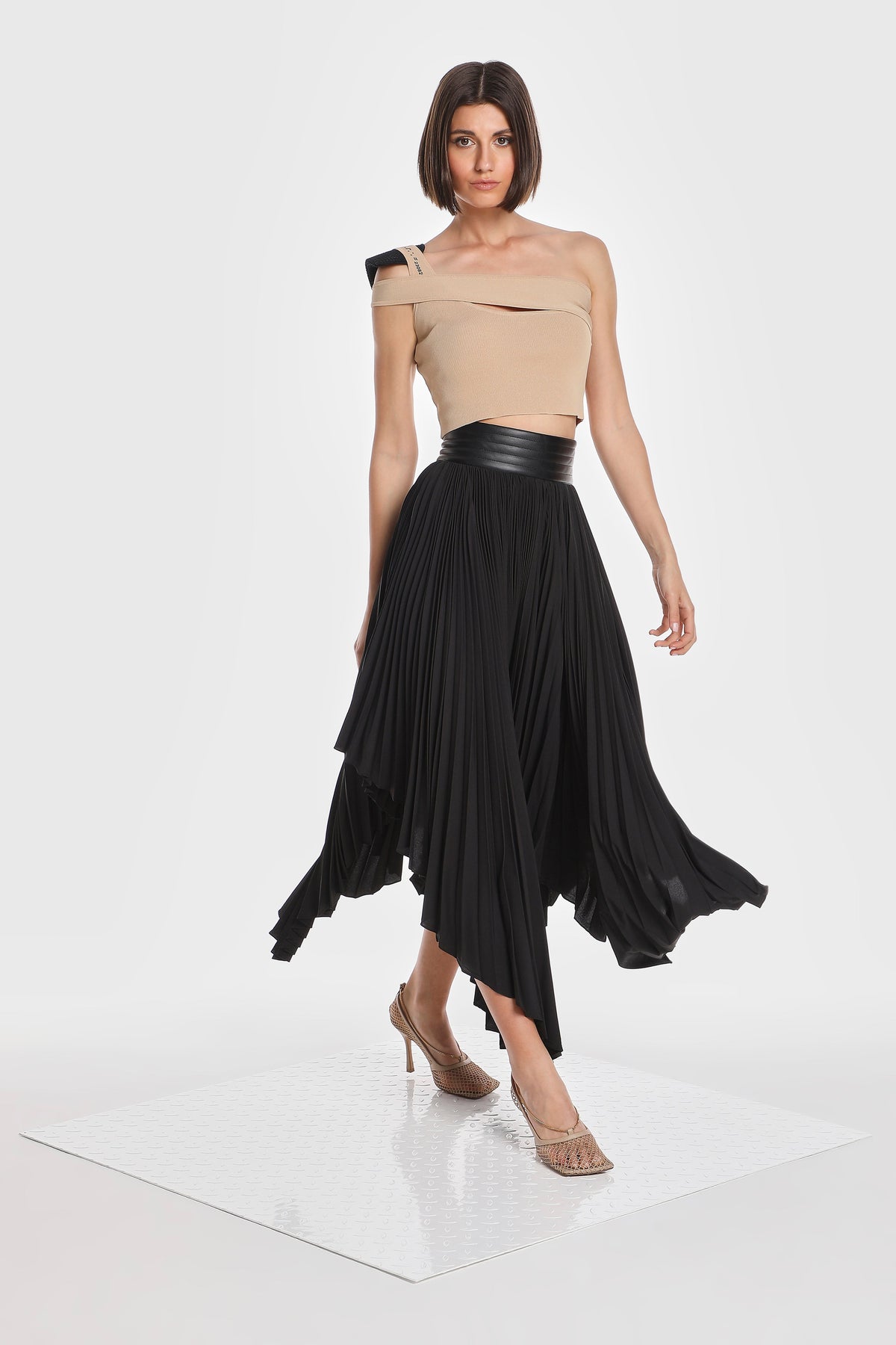 ASYMMETRIC PLEATED SKIRT W/ VEGAN LEATHER WAIST