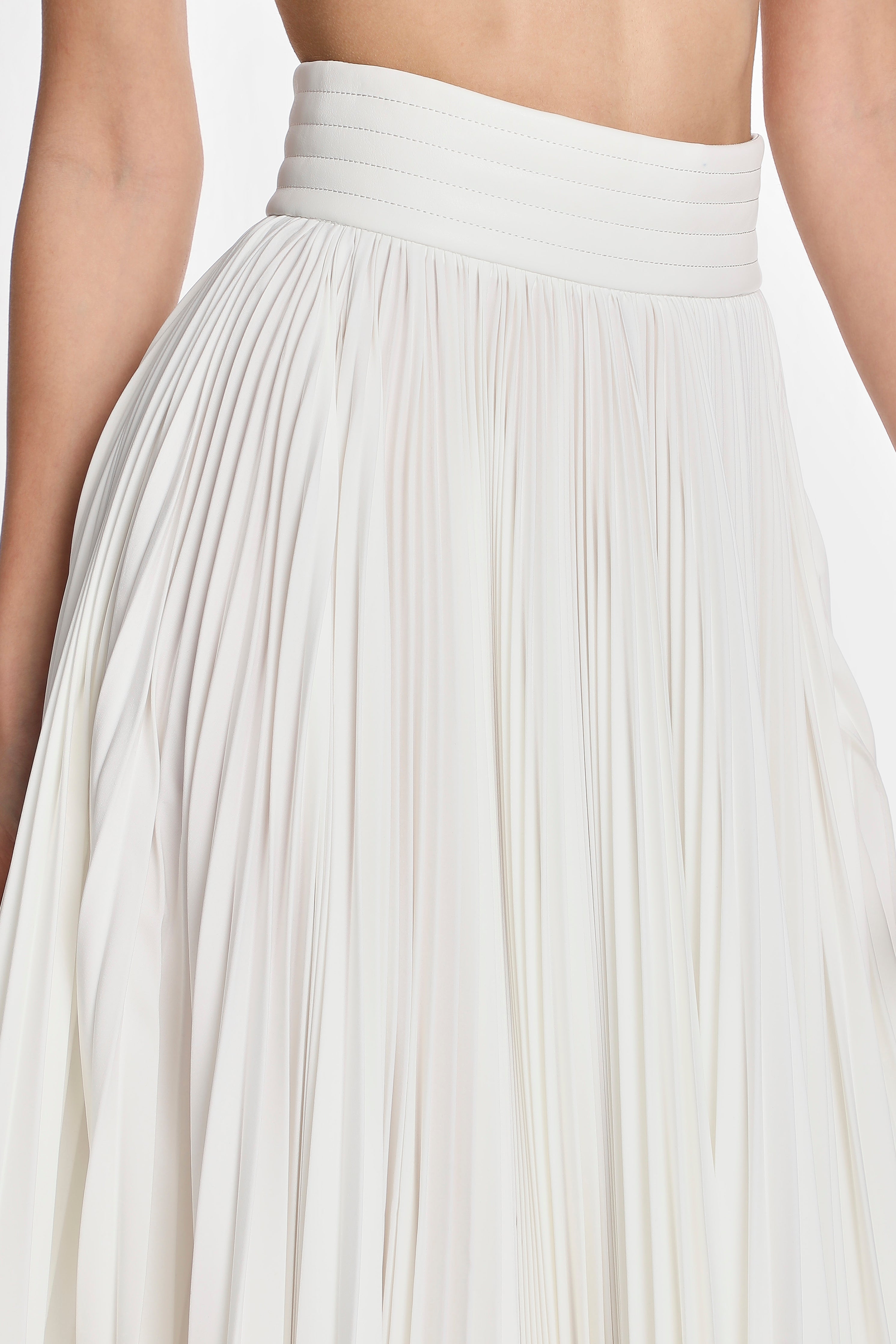 ASYMMETRIC PLEATED SKIRT W/ VEGAN LEATHER WAIST