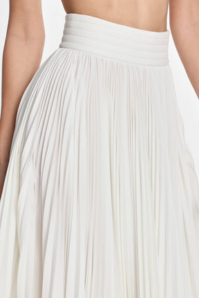 ASYMMETRIC PLEATED SKIRT W/ VEGAN LEATHER WAIST