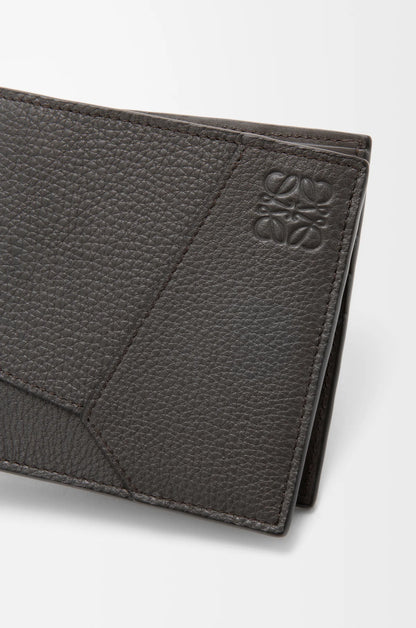 Puzzle bifold wallet in supple grained calfskin