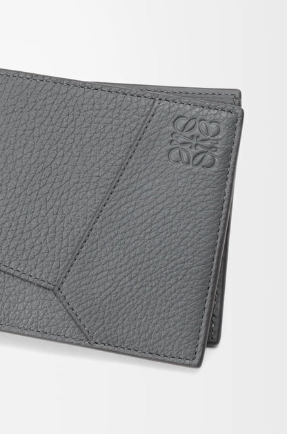 Puzzle bifold wallet in supple grained calfskin