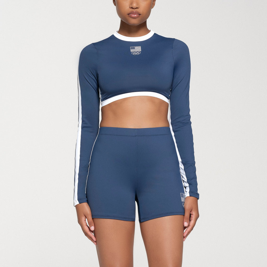 SKIMS FOR TEAM USA SIGNATURE SWIM OLYMPIC LONG SLEEVE CROPPED T-SHIRT | NAVY