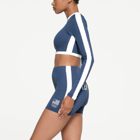 SKIMS FOR TEAM USA SIGNATURE SWIM OLYMPIC LONG SLEEVE CROPPED T-SHIRT | NAVY