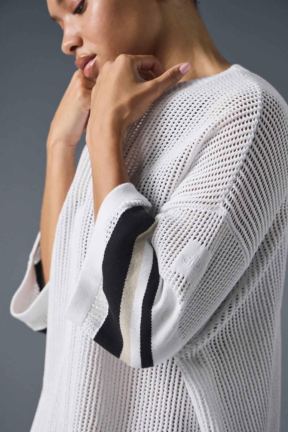 Open knit playoff jersey featuring wide exaggerated arms and open-knit weave for a cool, stylish look.