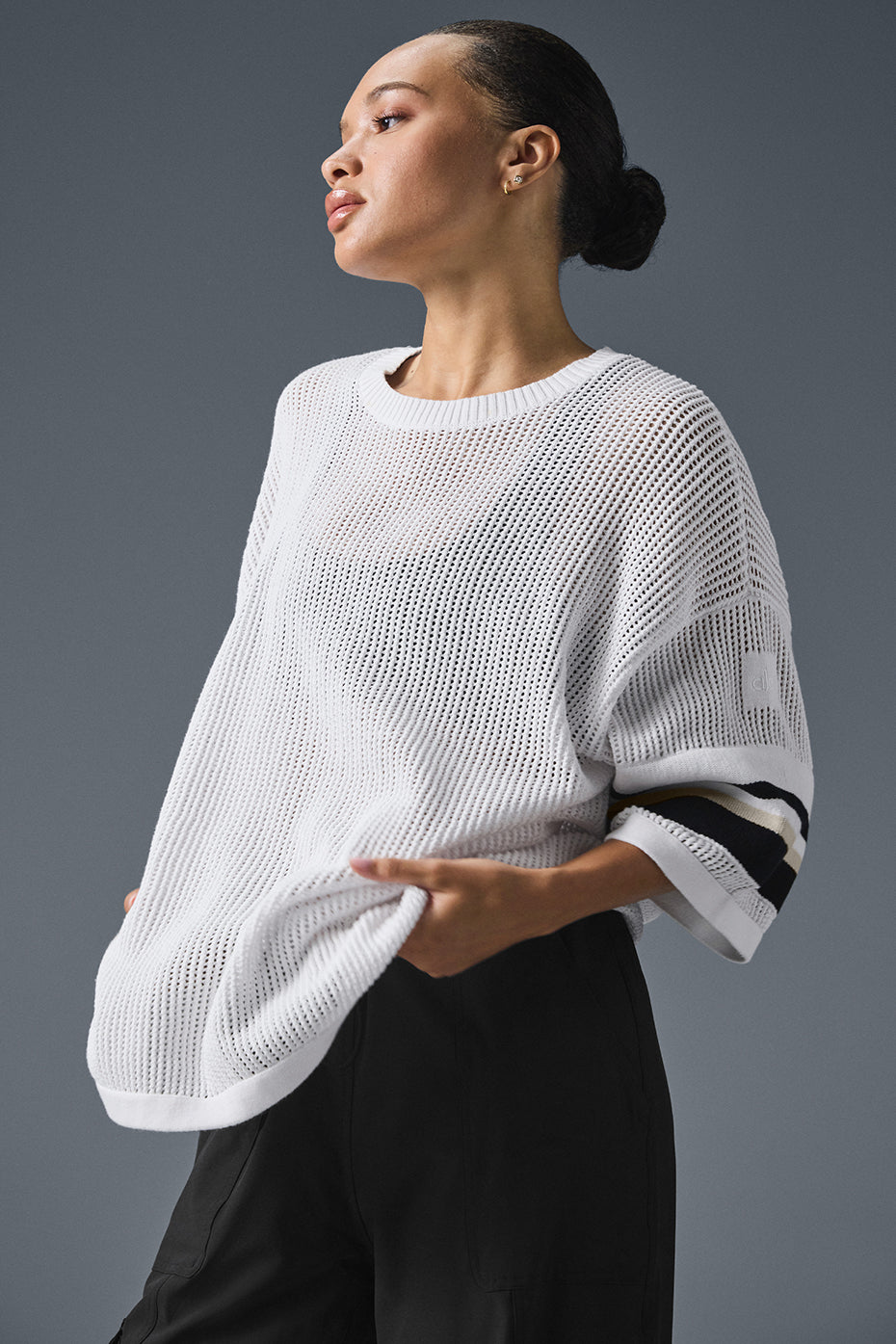 Open knit playoff jersey featuring wide exaggerated arms and an open-knit weave for a stylish and cool look.