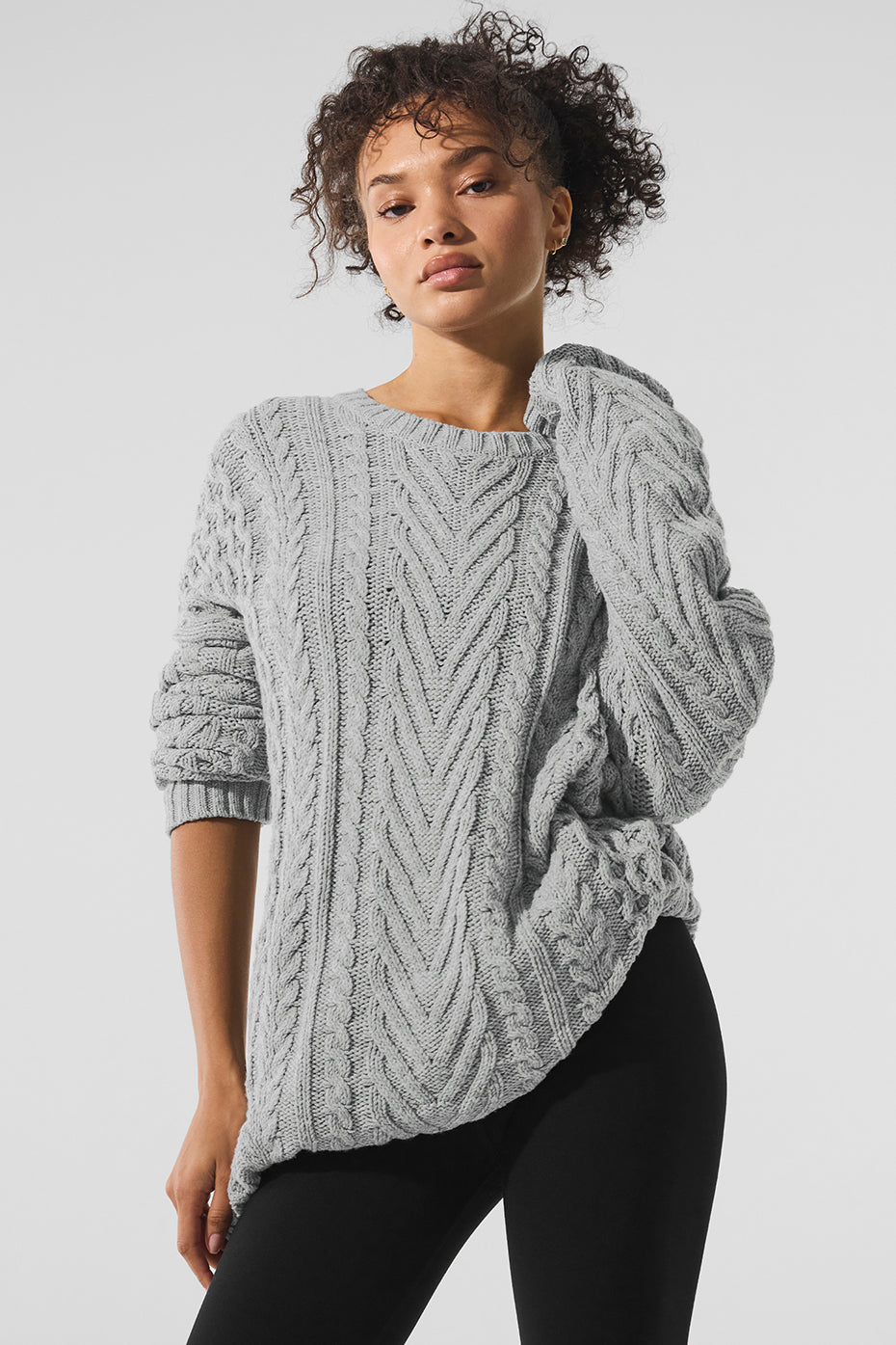 Cable knit crew neck sweater in gray, featuring a chunky knit design and relaxed silhouette, perfect for casual wear.