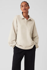Mixmatch Rugby Sweatshirt in beige with a sharp collar, 3-button placket, and oversized fit styled for a sporty look.