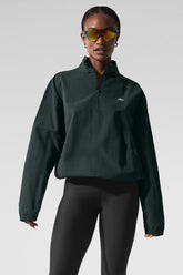 Light Weight Takeaway Track Pullover in dark green with quarter-zip neck and relaxed fit, styled with sunglasses.