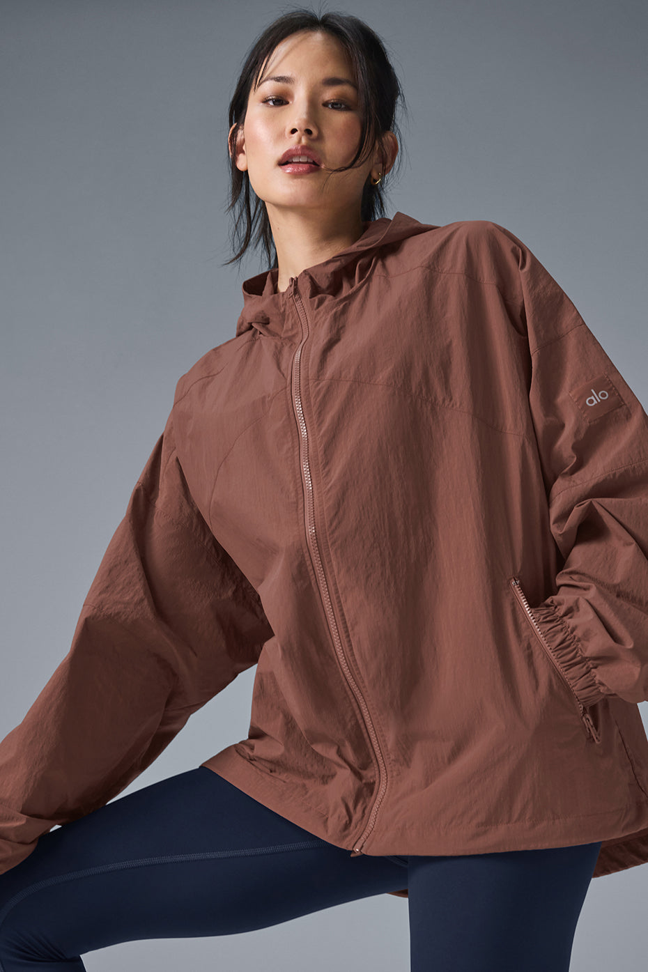 Vantage Nylon Ripstop Track Jacket in brown with structured hood, full-zip front, and cuffed sleeves, ideal for training and cool weather.