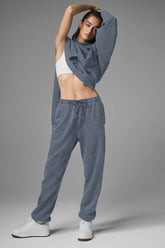 Woman wearing Chill Vintage Wash Sweatpant with a matching oversized hoodie in a stylish pose showing comfort and casual fashion.