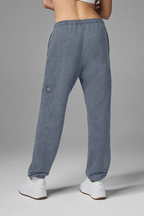 Back view of Chill Vintage Wash Sweatpant in faded blue color, featuring stretchy drawstring waist and cuffed hems.