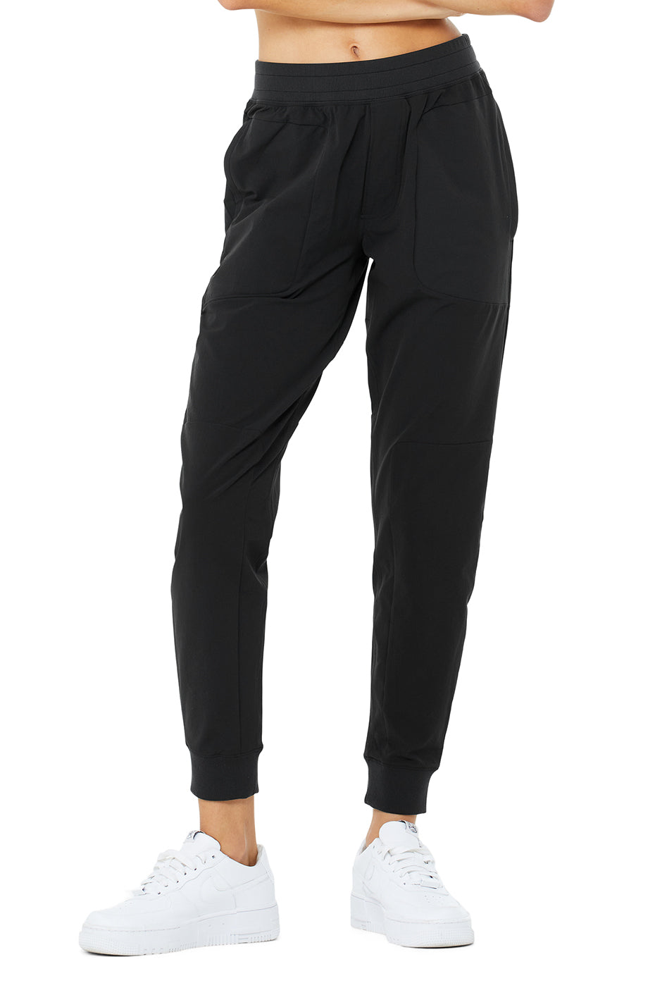 Sleek black Co-Op Pant with elastic waistband, water-repellent fabric, and side-zip pockets for performance.