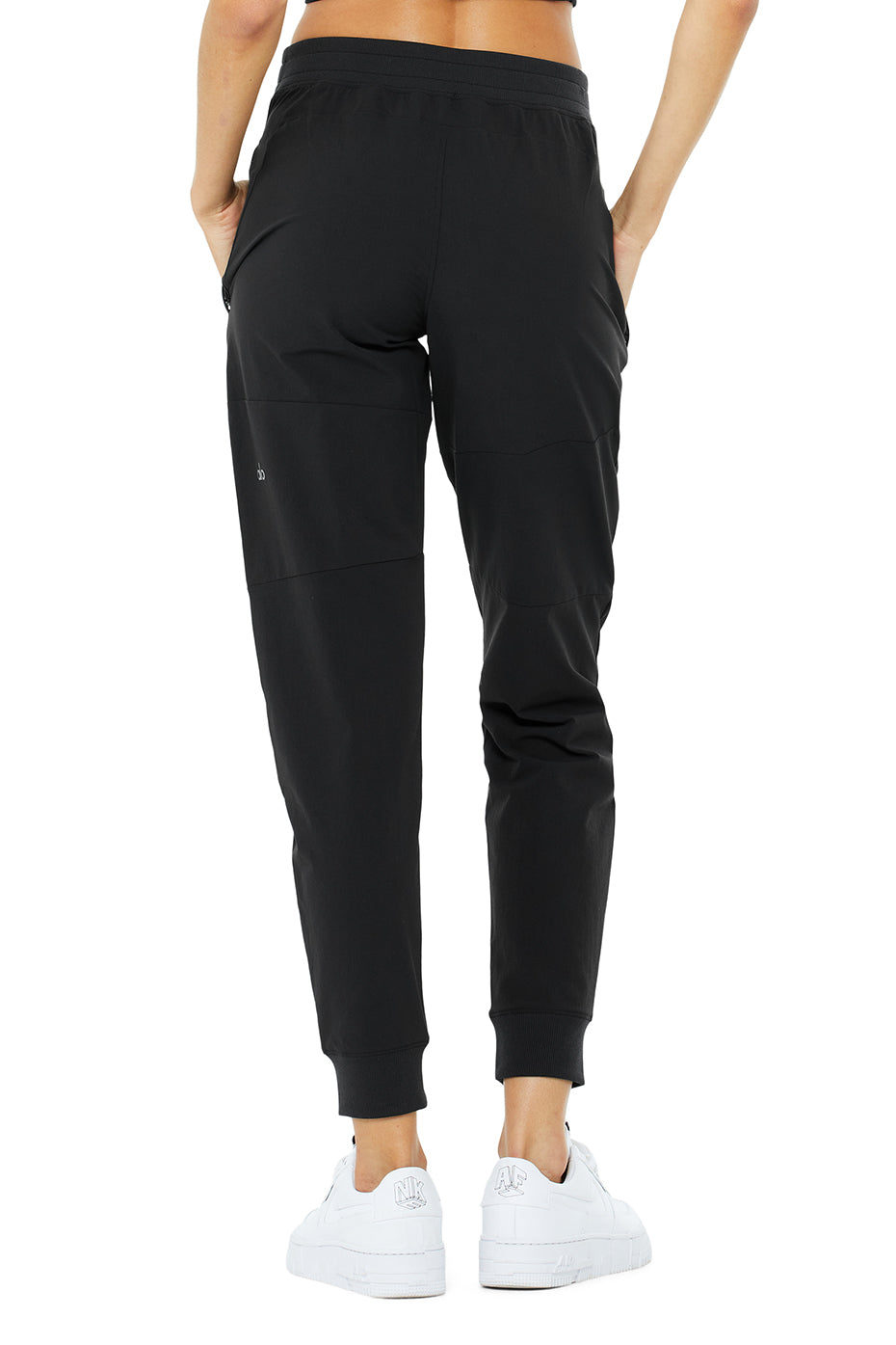 Co-Op Pant back view featuring sleek design, elastic waistband, side-zip pockets, and water-repellent material.