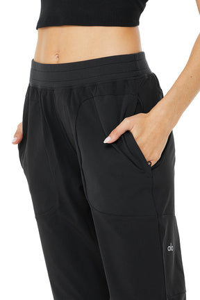 Co-Op Pant featuring an elastic waistband and side-zip pockets, showcasing sleek and streamlined design.