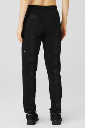 Back view of Nomadic Sweatpant featuring webbing details, secure zippered pockets, and comfortable fit.