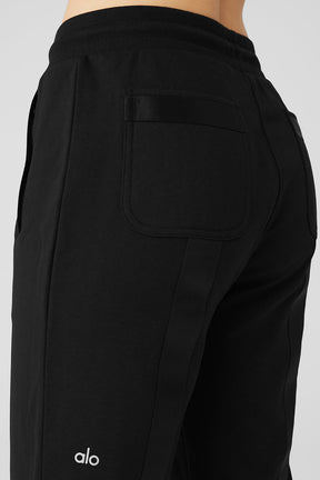 Close-up of Nomadic Sweatpant showing back pocket and webbing details on leg for comfortable casual wear.