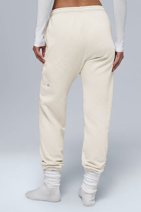Back view of Chill Sweatpant in cream color, featuring cuffed bottoms and soft breathable fabric.