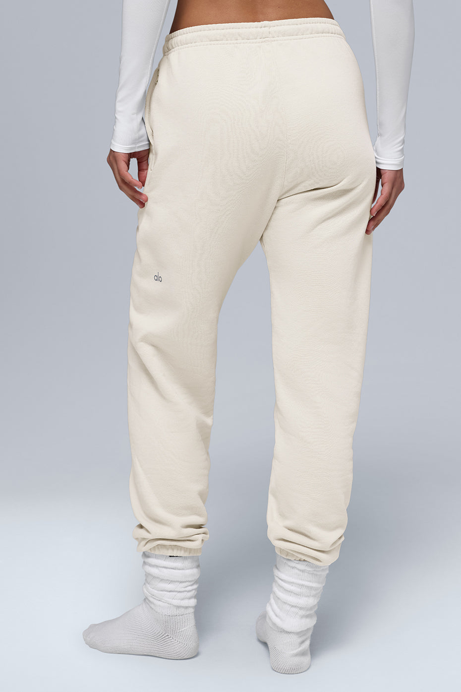 Back view of Chill Sweatpant in cream color, featuring cuffed bottoms and soft breathable fabric.