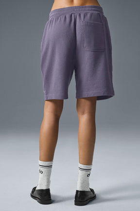 Back view of Chill Short in purple French terry featuring a single pocket and comfortable fit for lounging.