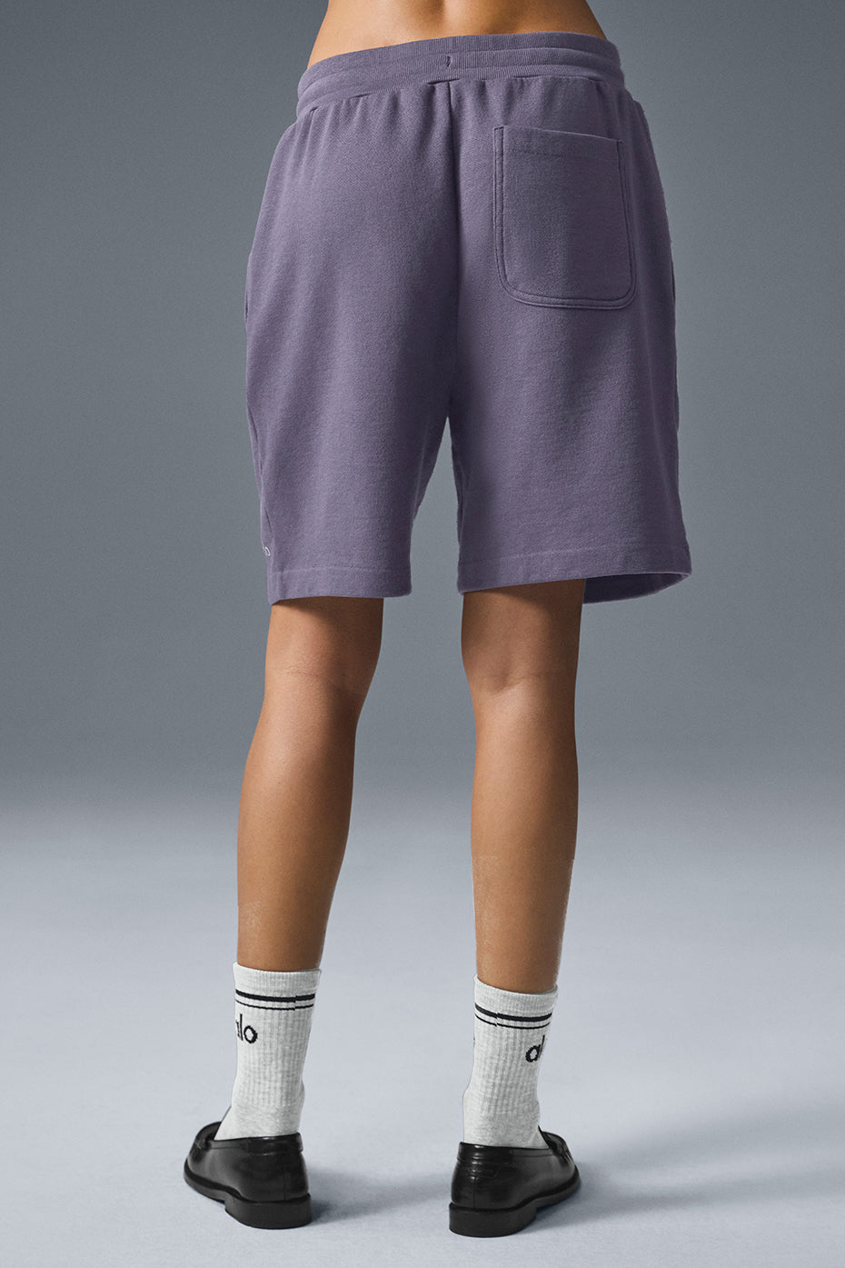 Back view of Chill Short in purple French terry featuring a single pocket and comfortable fit for lounging.