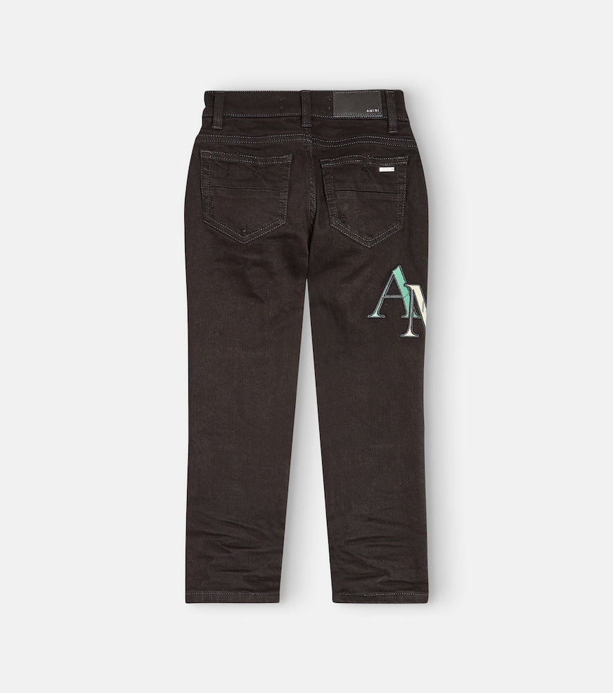 Distressed logo skinny jeans