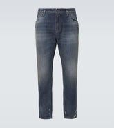 Distressed slim jeans