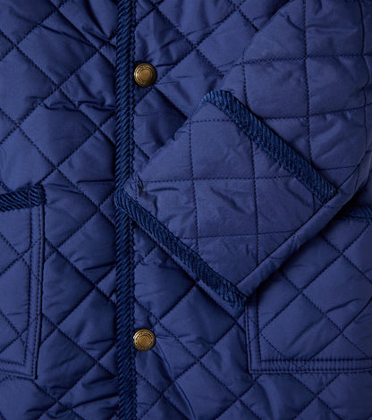 Baby corduroy-trimmed quilted onesie