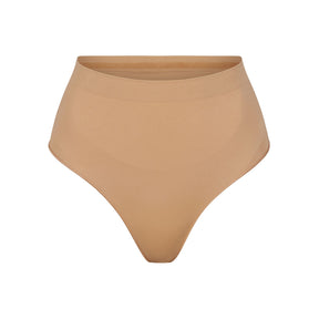 SEAMLESS SCULPT MID WAIST THONG | OCHRE
