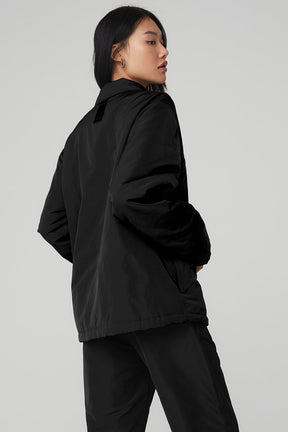 Back view of Legend Jacket in black, featuring a sleek design and cozy fit, ideal for any outfit.
