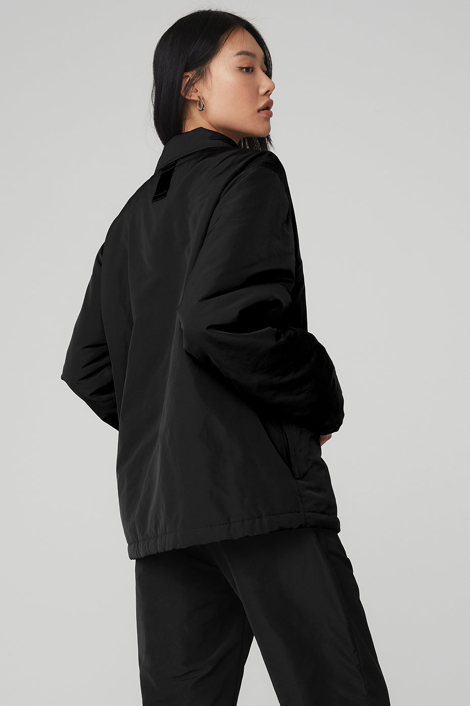 Back view of Legend Jacket in black, featuring a sleek design and cozy fit, ideal for any outfit.