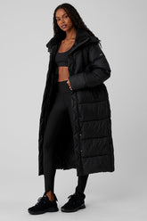 Gold Rush Puffer Trench in black, featuring oversized fit and sherpa-lined collar for winter warmth.