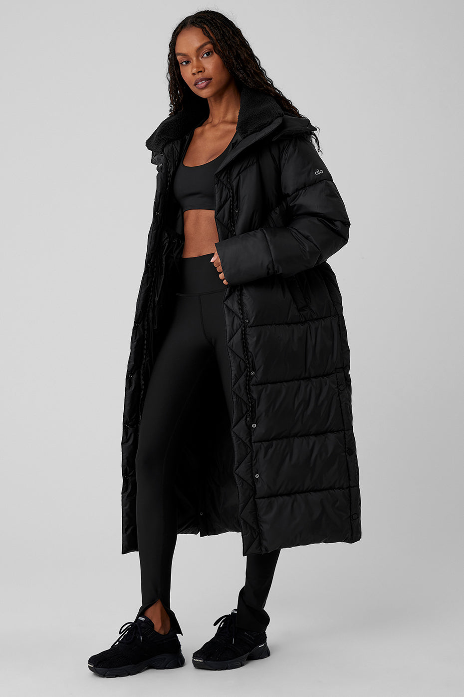 Gold Rush Puffer Trench in black, featuring oversized fit and sherpa-lined collar for winter warmth.